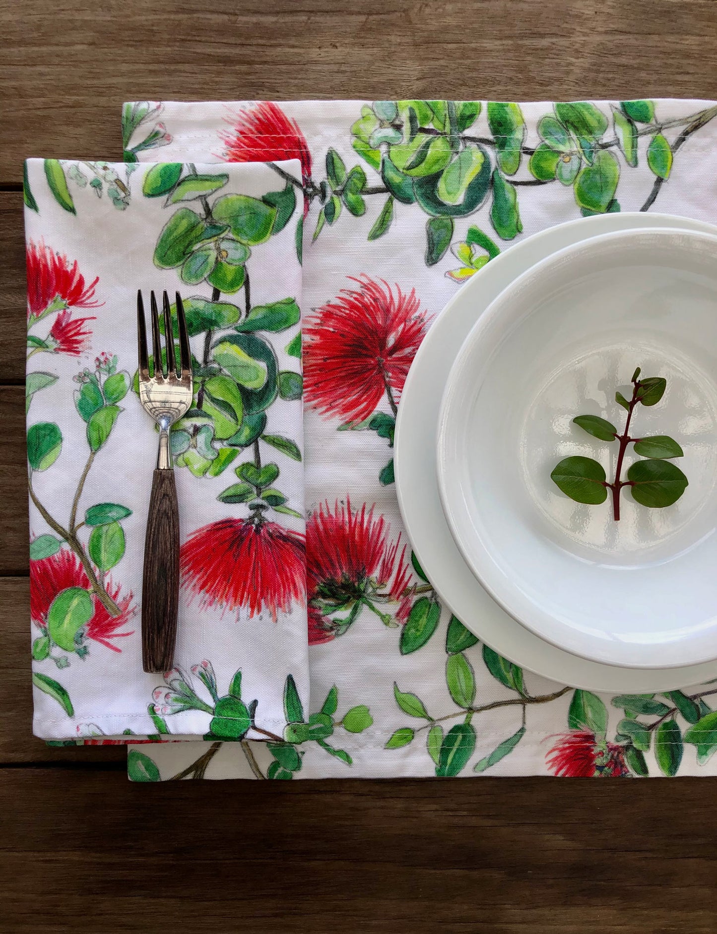 'Ōhi'a Lehua floral placemats along with a linen